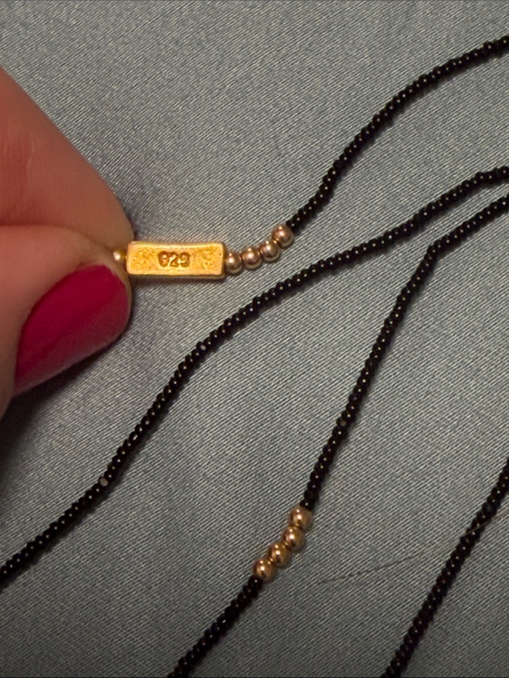 Elegant Black Beaded Layered Necklace with Gold Accents